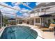 Stunning pool and patio area with ample seating and a well-maintained pool and screen enclosure at 5479 Baytowne Pl, Oviedo, FL 32765