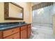 Bathroom with vanity, framed mirror, shower, and bathtub combination at 6125 Foxfield Ct, Windermere, FL 34786