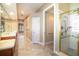 Bright bathroom featuring walk-in glass shower and dual sink vanity at 6125 Foxfield Ct, Windermere, FL 34786