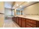 Bathroom with double vanity, large mirror, bathtub, and tiled floor at 6125 Foxfield Ct, Windermere, FL 34786