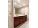 Bathroom with single sink vanity, large mirror, and glass shower at 6125 Foxfield Ct, Windermere, FL 34786