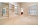 Bright bedroom with large built-in shelving unit and shuttered window at 6125 Foxfield Ct, Windermere, FL 34786