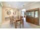 Elegant dining room featuring a glass table, built-in buffet, and classic decor at 6125 Foxfield Ct, Windermere, FL 34786