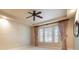 Inviting main bedroom with neutral tones, tray ceiling, and natural light from bay windows at 6125 Foxfield Ct, Windermere, FL 34786