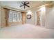 Spacious bedroom featuring tray ceilings, large windows, and luxurious window treatments at 6125 Foxfield Ct, Windermere, FL 34786