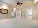 Expansive main bedroom featuring neutral colors, with multiple doorways to other rooms at 6125 Foxfield Ct, Windermere, FL 34786