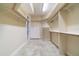 Spacious walk-in closet features custom shelving, drawers, and ample storage space for clothing and accessories at 6125 Foxfield Ct, Windermere, FL 34786