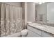 Bathroom features a shower-tub combo with granite countertop and white vanity at 676 Bishop Bay Loop, Apopka, FL 32712