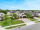 Beautiful two-story home featuring a two-car garage, mature palms, and an inviting front yard at 676 Bishop Bay Loop, Apopka, FL 32712