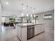 Spacious kitchen island provides ample counter space and connects the kitchen to the living area at 676 Bishop Bay Loop, Apopka, FL 32712
