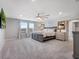 Inviting main bedroom with neutral walls, plush carpeting, decor headboard, and modern ceiling fan at 676 Bishop Bay Loop, Apopka, FL 32712