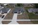 Overhead perspective shows a home, spacious driveway, and simple front yard at 699 Marion Oaks Trl, Ocala, FL 34473