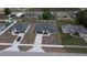 A home with newly laid sod and a concrete driveway, as viewed from above at 699 Marion Oaks Trl, Ocala, FL 34473
