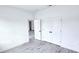 Spacious bedroom with neutral color palette, large window, and double door closet at 699 Marion Oaks Trl, Ocala, FL 34473