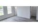 Bright bedroom featuring new vinyl flooring, white trim and window views at 699 Marion Oaks Trl, Ocala, FL 34473