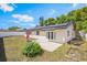 Expansive backyard featuring a patio, lush greenery, and a well-manicured lawn at 725 Laurel Way, Casselberry, FL 32707