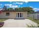 This backyard has a concrete patio and double doors leading into the home for easy entertaining at 725 Laurel Way, Casselberry, FL 32707