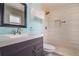 Updated bathroom with walk-in shower, modern vanity and storage at 725 Laurel Way, Casselberry, FL 32707