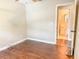 Bright bedroom with hardwood floors, and attached bathroom at 725 Laurel Way, Casselberry, FL 32707