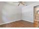 Bedroom with wood-look floors and access to ensuite bathroom at 725 Laurel Way, Casselberry, FL 32707