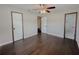 Bright bedroom featuring hardwood floors and ample closet space at 725 Laurel Way, Casselberry, FL 32707