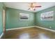 Bedroom with wood-look flooring and bright natural light at 725 Laurel Way, Casselberry, FL 32707