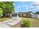 Inviting single-story home with a well-manicured lawn and a convenient two-car garage at 725 Laurel Way, Casselberry, FL 32707
