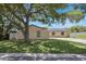 The home shows a well-manicured lawn and a privacy fence at 725 Laurel Way, Casselberry, FL 32707
