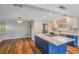 Bright kitchen featuring a large island with counter seating, modern appliances, and ample cabinet space at 725 Laurel Way, Casselberry, FL 32707