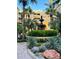 Picturesque courtyard showcasing a central fountain, lush greenery, and palm trees surrounding the charming building at 860 N Orange Ave # 460, Orlando, FL 32801