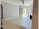 Cozy living room with sleek tile floors, a fireplace, and a sliding door to the outside at 860 N Orange Ave # 460, Orlando, FL 32801