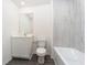 Bathroom with a tiled shower, vanity, toilet, and modern fixtures at 914 Poppy Ln, Dundee, FL 33838
