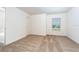 Bright bedroom features neutral carpet, a window with blinds, and a closet at 914 Poppy Ln, Dundee, FL 33838