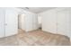 Spacious bedroom with multiple doorways and neutral carpet at 914 Poppy Ln, Dundee, FL 33838