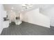A spacious room with neutral paint, and stylish gray wood-look floors at 914 Poppy Ln, Dundee, FL 33838