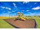 Community playground area with slides, swings, and play equipment at 914 Poppy Ln, Dundee, FL 33838