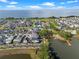Aerial view of property in community near a large pond, playground, mature trees, and walking trails at 921 Bradenville Ln, Winter Garden, FL 34787