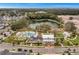 Aerial view of community pool, clubhouse and pond in a beautiful neighborhood at 921 Bradenville Ln, Winter Garden, FL 34787