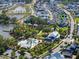Aerial shot featuring a community pool and clubhouse, emphasizing the property's location near a lake and community amenities at 921 Bradenville Ln, Winter Garden, FL 34787