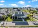 Aerial view of a two-story home with a charming front porch in a well-manicured community at 921 Bradenville Ln, Winter Garden, FL 34787