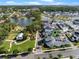 Aerial view of home in community with two ponds, green space, mature trees, sidewalks, and playgrounds at 921 Bradenville Ln, Winter Garden, FL 34787