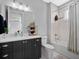 Bathroom with vanity, mirror, shower over tub, and tiled floor at 921 Bradenville Ln, Winter Garden, FL 34787