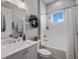 Bathroom with white subway tile, white vanity and tub for relaxation at 921 Bradenville Ln, Winter Garden, FL 34787