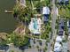 Aerial of the neighborhood pool with lush surroundings near a lake, landscaping, and a ' play area at 921 Bradenville Ln, Winter Garden, FL 34787
