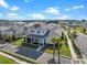 Charming two-story home with a screened-in porch and well-maintained landscaping in a desirable neighborhood at 921 Bradenville Ln, Winter Garden, FL 34787