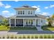 Charming two-story home with a screened-in porch, landscaped yard, and inviting curb appeal at 921 Bradenville Ln, Winter Garden, FL 34787