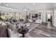 Inviting living room with modern decor, natural light, and views of the backyard at 921 Bradenville Ln, Winter Garden, FL 34787