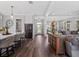 Open living space featuring hardwood floors, a modern kitchen, and a seamless flow between rooms at 921 Bradenville Ln, Winter Garden, FL 34787
