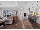 Bright open living space featuring hardwood floors, a modern kitchen, and a view of the outdoor patio at 921 Bradenville Ln, Winter Garden, FL 34787
