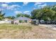 Charming single-story home with a stucco exterior and a well-maintained front yard at 1056 Pinder St, Deltona, FL 32725